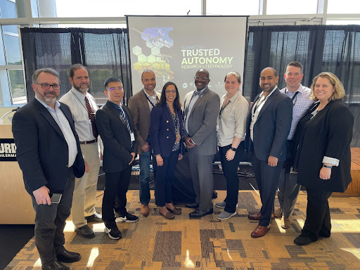 (From left to right): Dana Franz (PD Autonomy), Mike DiPaolo, (PD Autonomy), Shaoshuai Mou (Purdue), Shreyas Sundaram (Purdue), Neera Jain (Purdue), Dr. Jaret Riddick (OSD(R&E)), Sarah Rigsbee (JHU IAA), Kedar Pavgi (NSIN), Reed Skaggs (Lewis Burke), and Cara LaPointe (JHU IAA